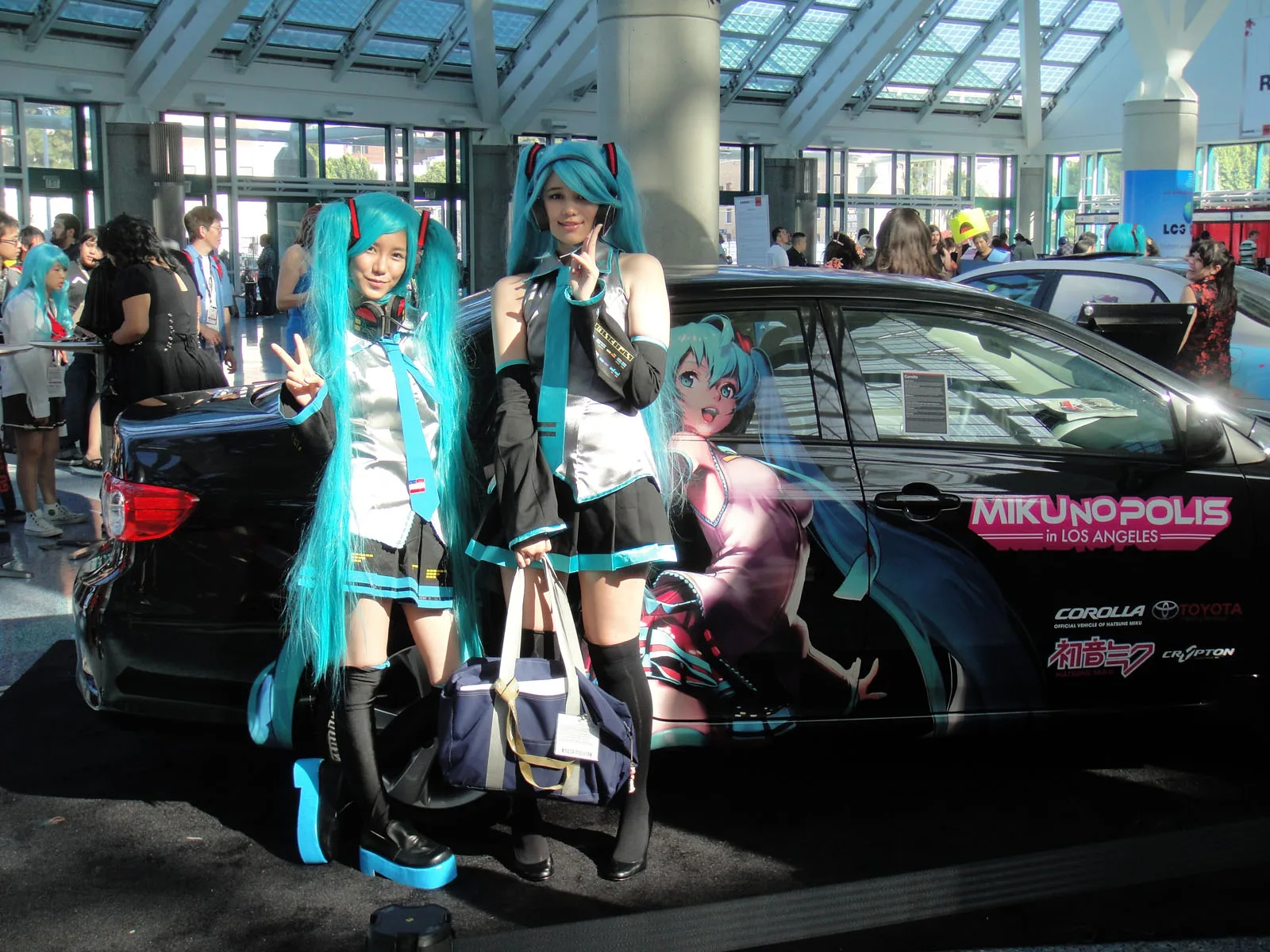Cosplayers and itasha of Hatsune Miku at Anime Expo 20110701